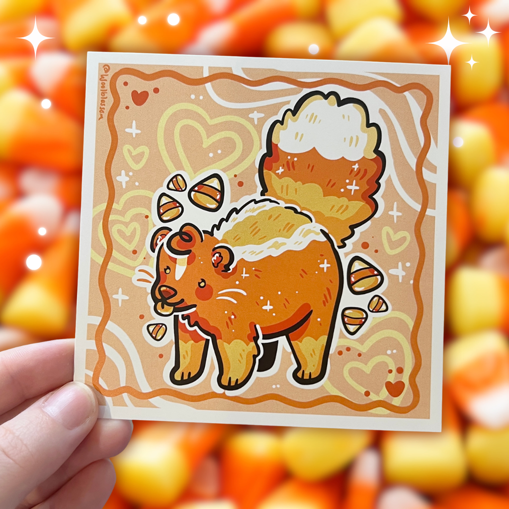 A print of a candy corn colored skunk