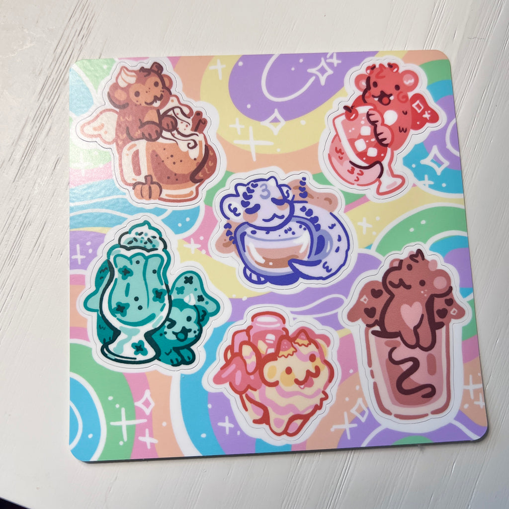 Set of colorful drink dragons on a sticker sheet on a white background