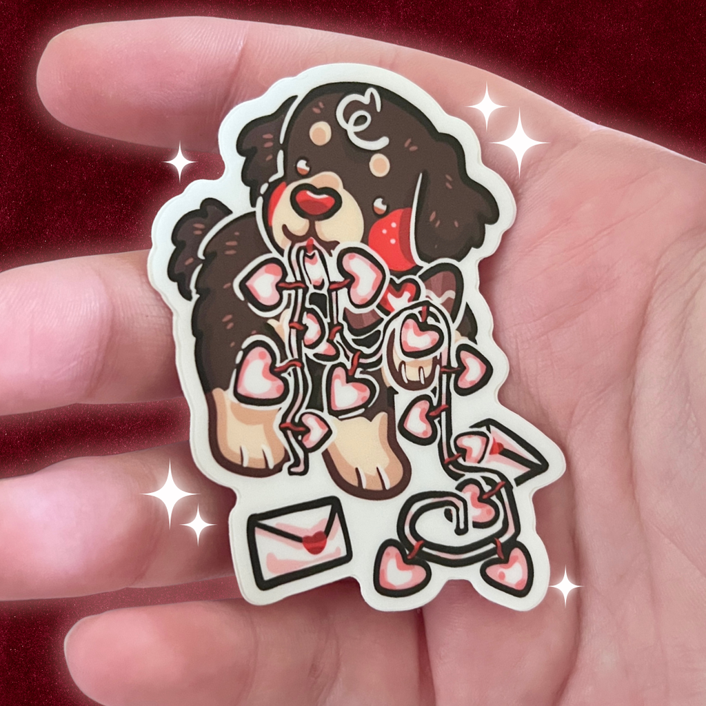 a sticker of a puppy with garland and letters