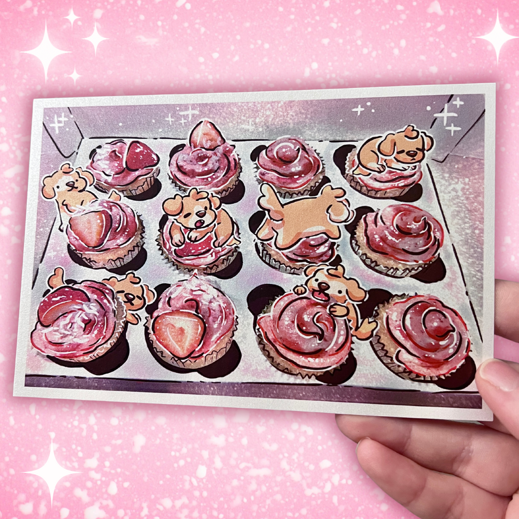 A print that is a draw over of a box of strawberry cupcakes, the draw over adding glitter and some golden puppies napping on and eating them