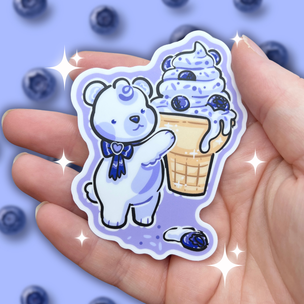 A sticker of a polar bear with blue bow and blue accents holding a huge blueberry ice cream cone