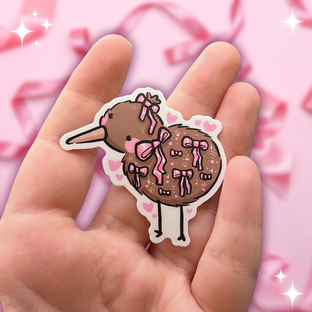 A sticker of a kiwi bird with various pink bows on it