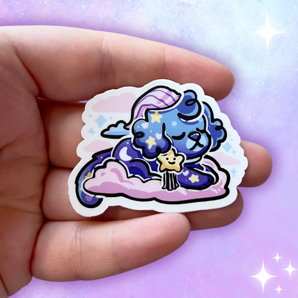 A sticker of a puppy with a bedtime cap, blue skin, and star bow on a pink cloud.