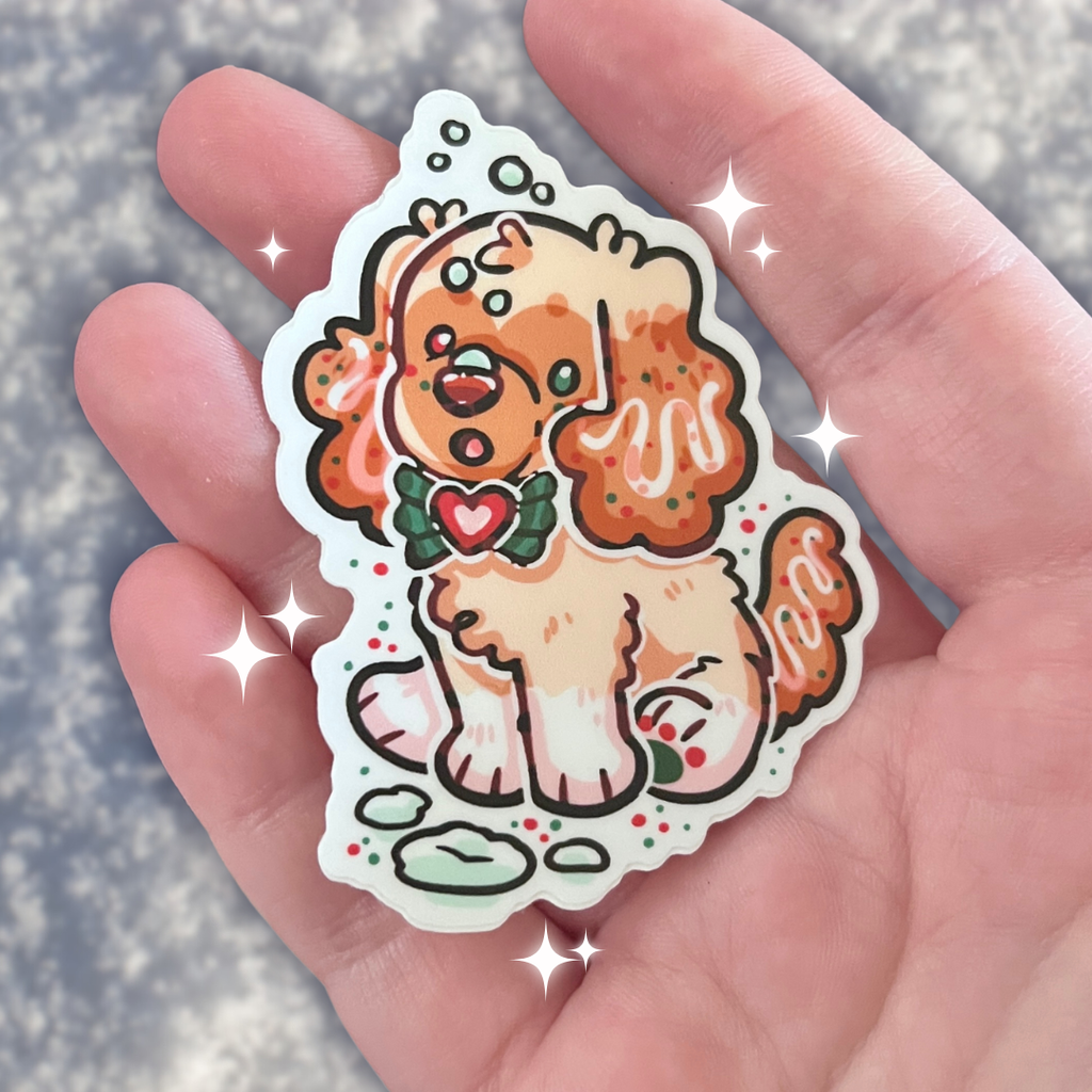 sticker of a golden puppy getting snow on her nose
