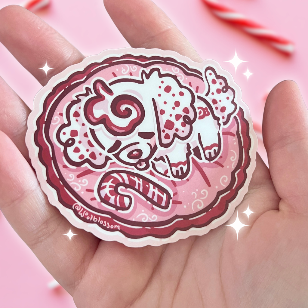 A sticker of a peppermint puppy curled up and sleeping in a dog bed