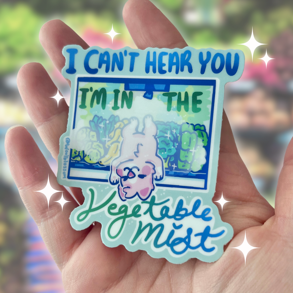 A sticker of a dog laying in the vegetable section of the grocery aisle with text that says "i cant hear you im in the vegetable mist"