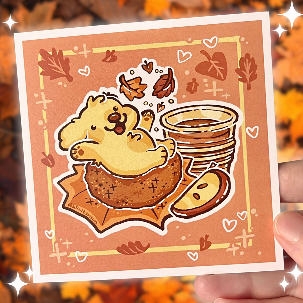 Cartoon dog on an apple doughnut on a print with autumn leaves.