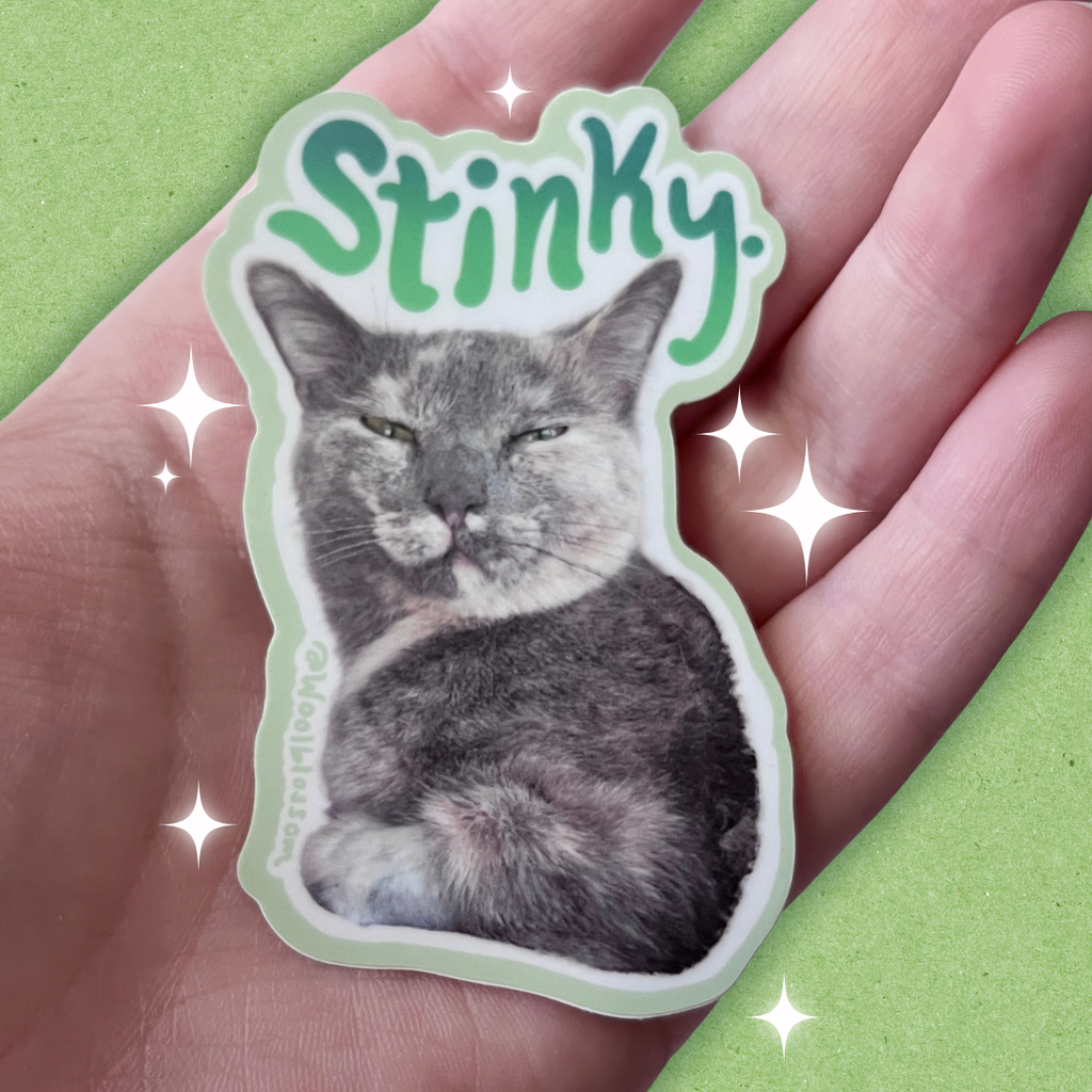 A sticker of chai my cat with text that says "stinky"