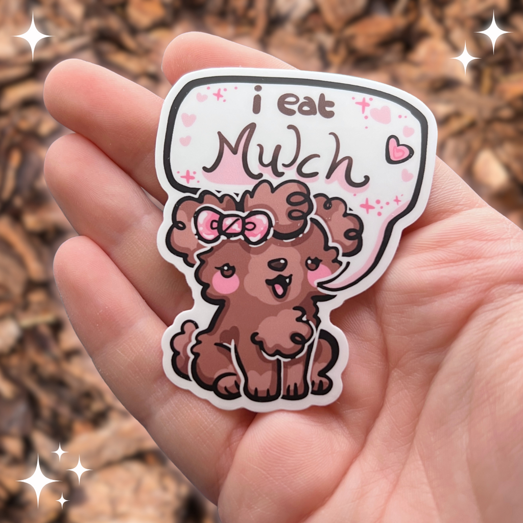 A sticker of a brown puppy with a pink bow that has a text bubble which says “I eat mulch”