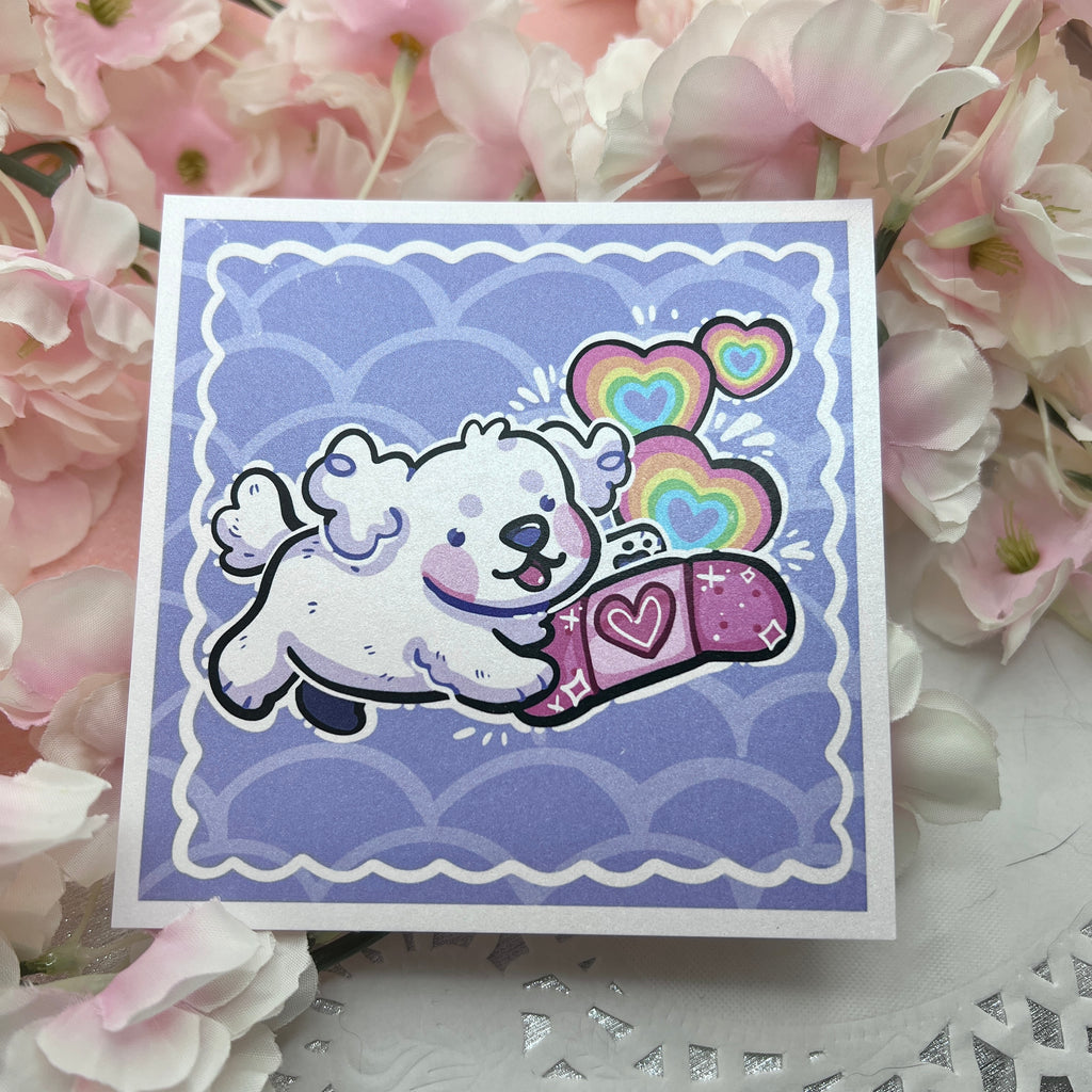 A print of a white puppy happily holding a pink bandage with rainbow hearts popping up