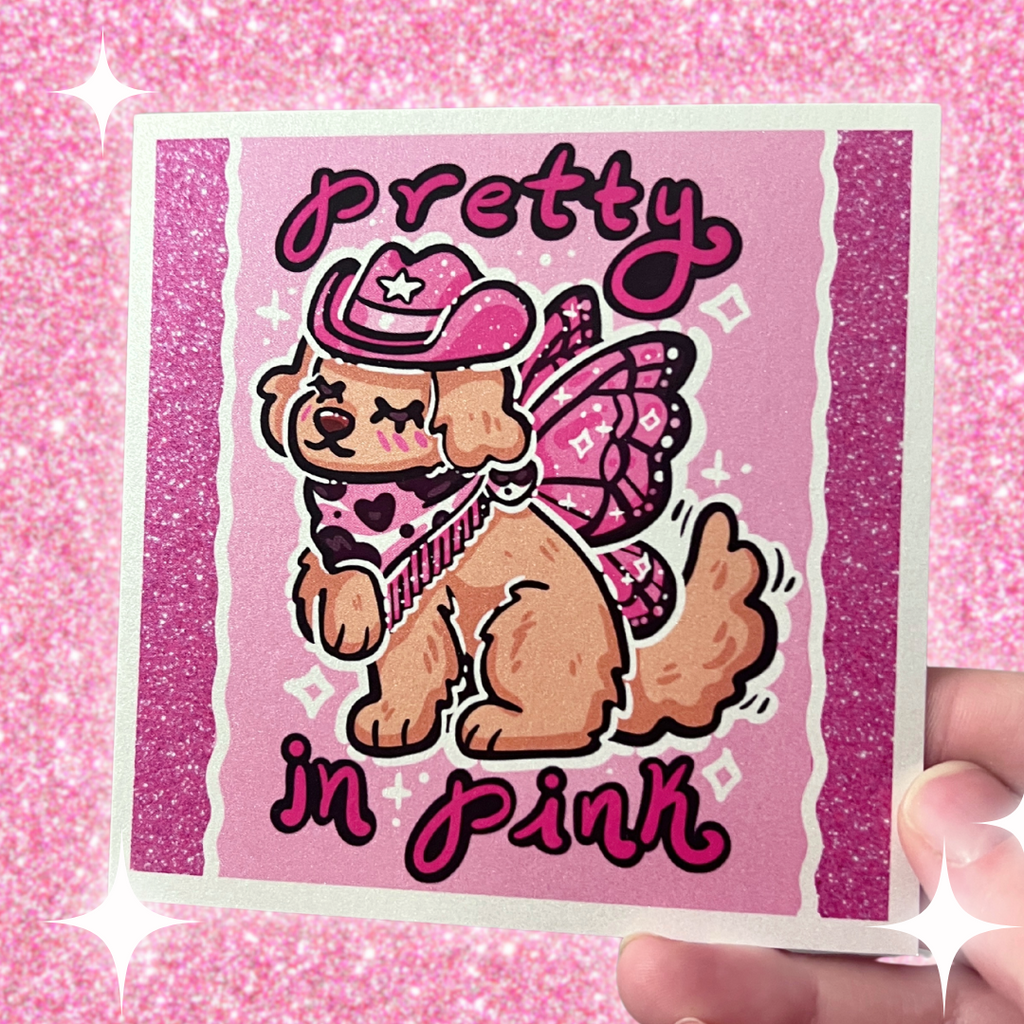 a pink of a golden retreiver with a pink cowgirl hat, boots, and dark pink fairy wings and text that says "pretty in pink"