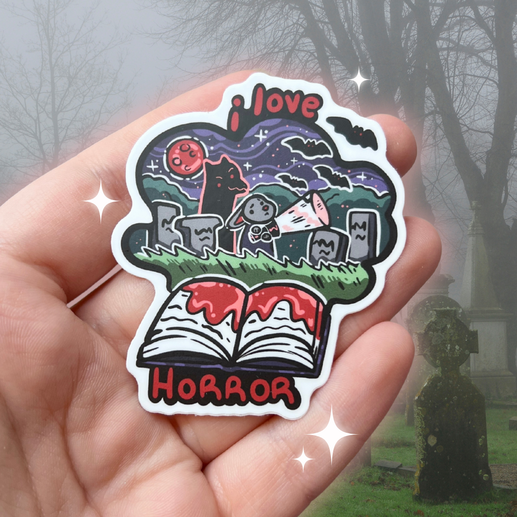 A book genre inspired sticker that says "I love horror" and features a bunny in a graveyard with a monster behind them