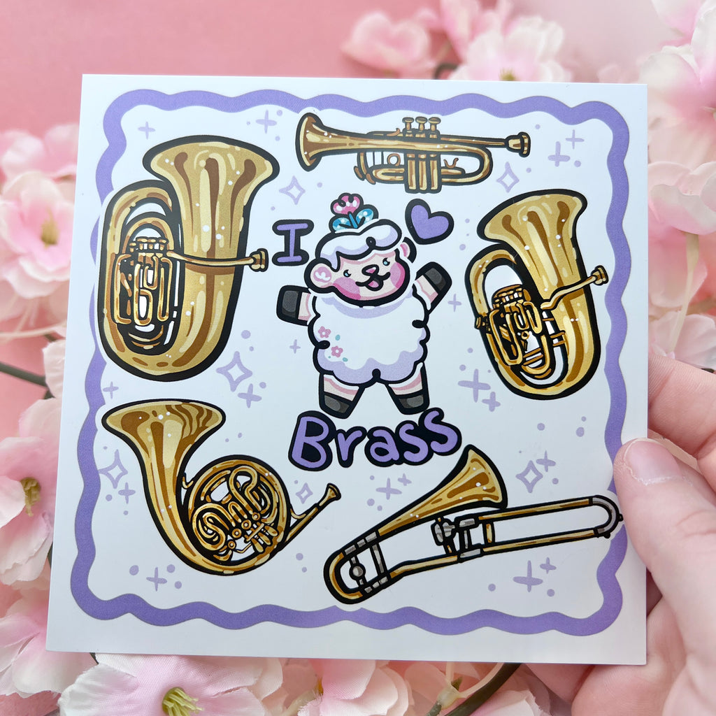 a print of a sheep with the text "I heart brass" and five instruments floating around them (tuba, trumpet, euphonium, trombone, and french horn)