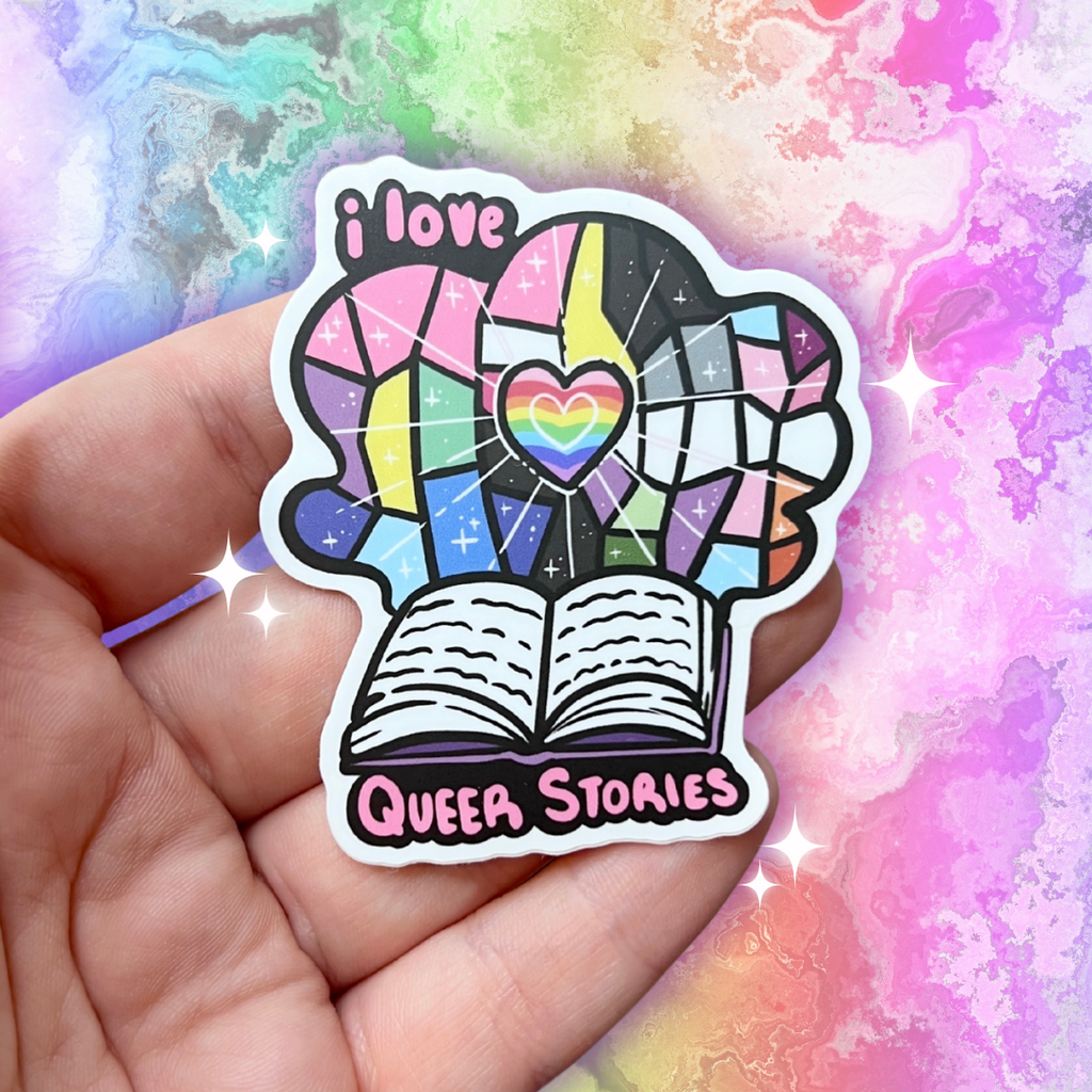 A book genre inspired sticker that says "I love queer stories" and features a variety of pride flags