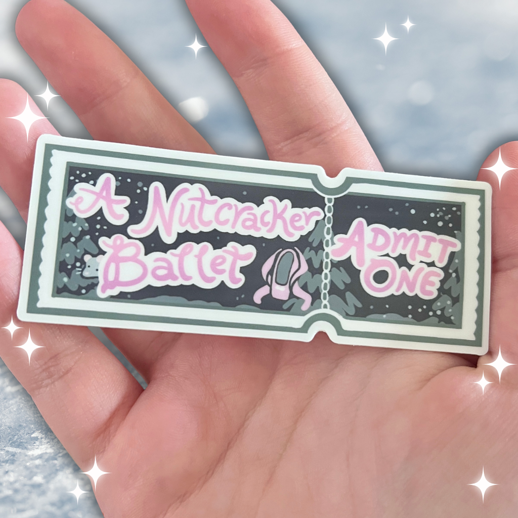 Sticker resembling a 'Nutcracker Ballet' ticket held in a hand with a sparkly background.