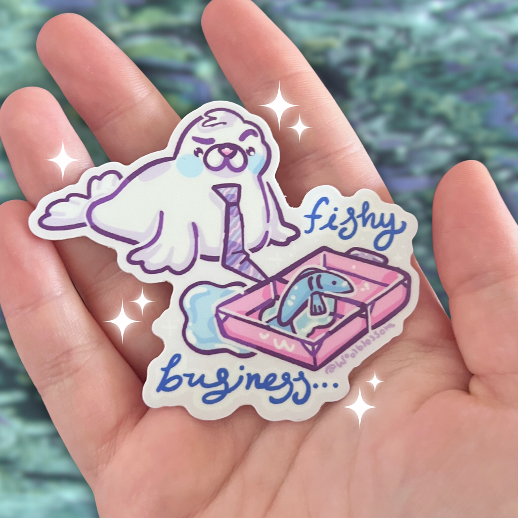A sticker of a seal in a tie who has an open suitcase with a fish inside and text that says "fishy business...."