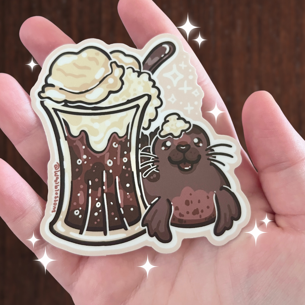 sticker of a seal next to a big glass of root beer float