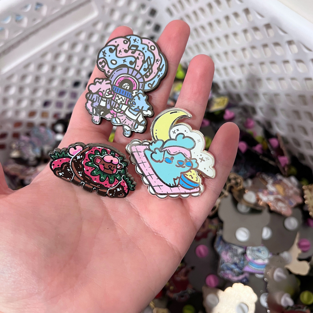 A hand holding some of the possible defect pins