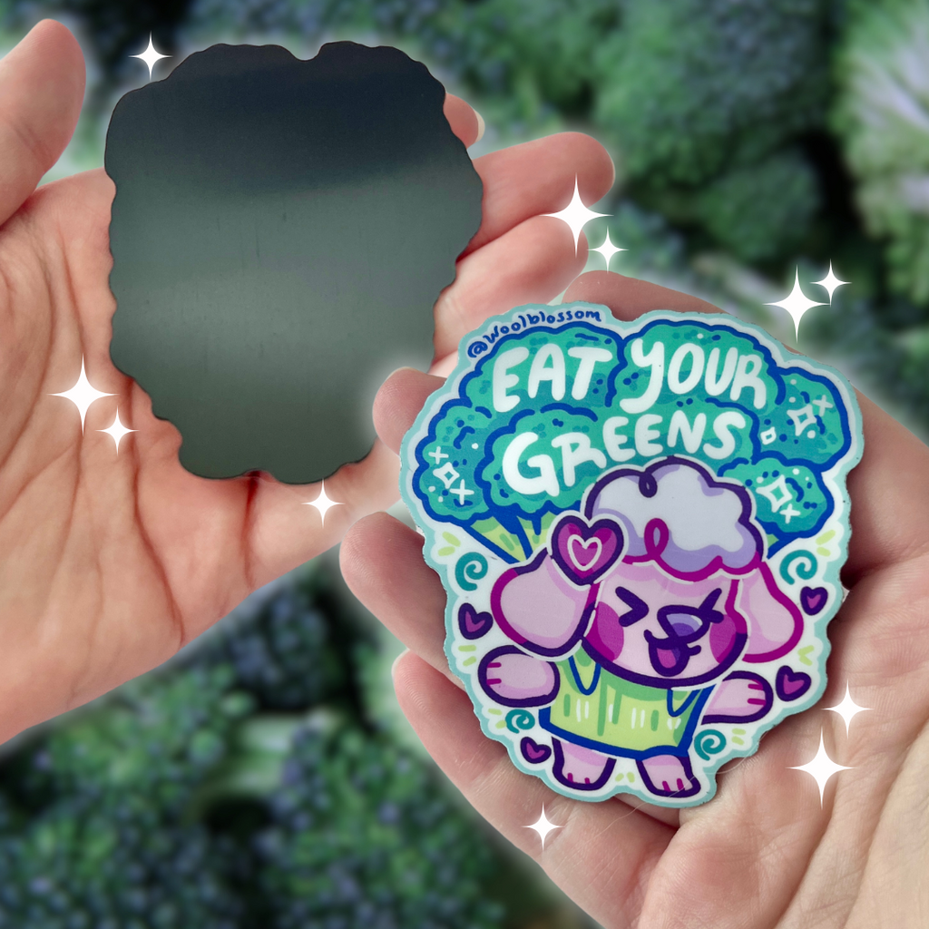 A magnet of cherry blossom the puppy in a broccoli suit, with text that says "eat your greens"