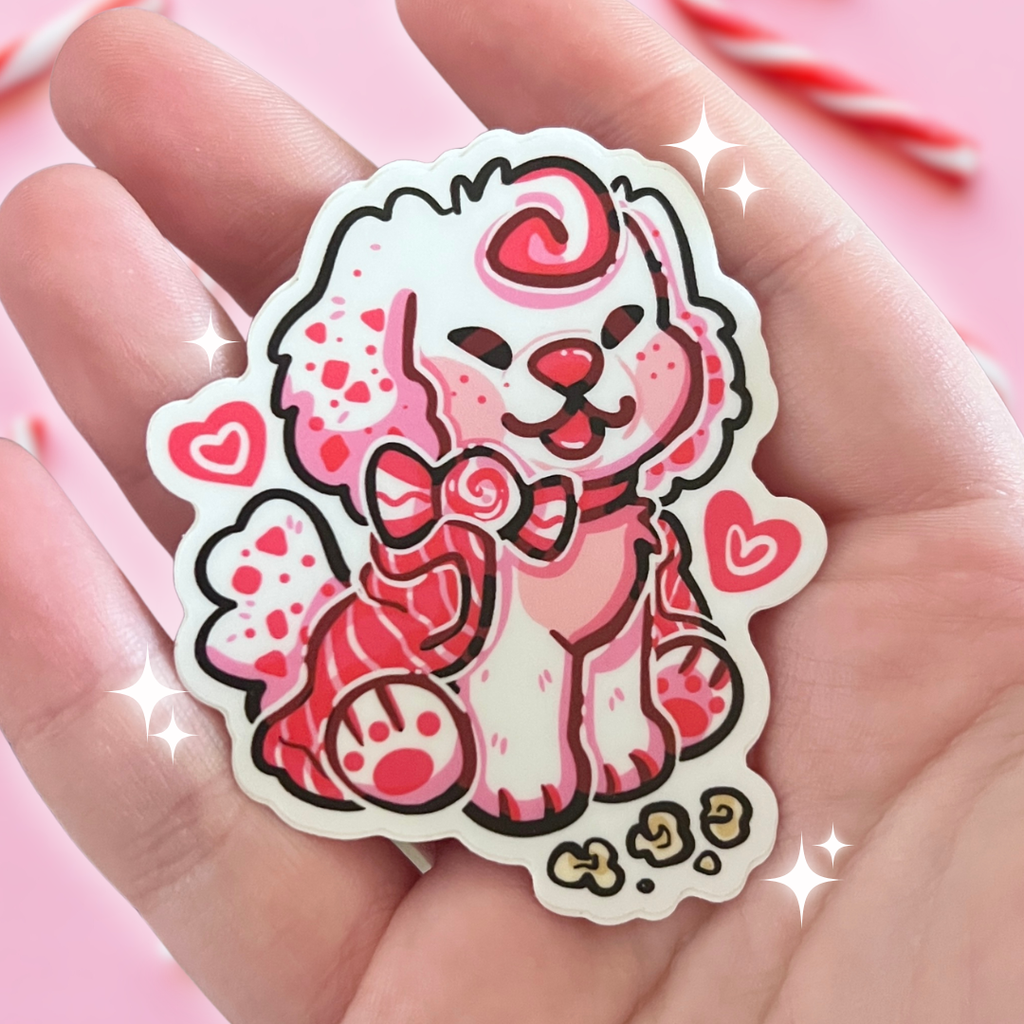 A sticker of a peppermint puppy with popcorn and a blanket