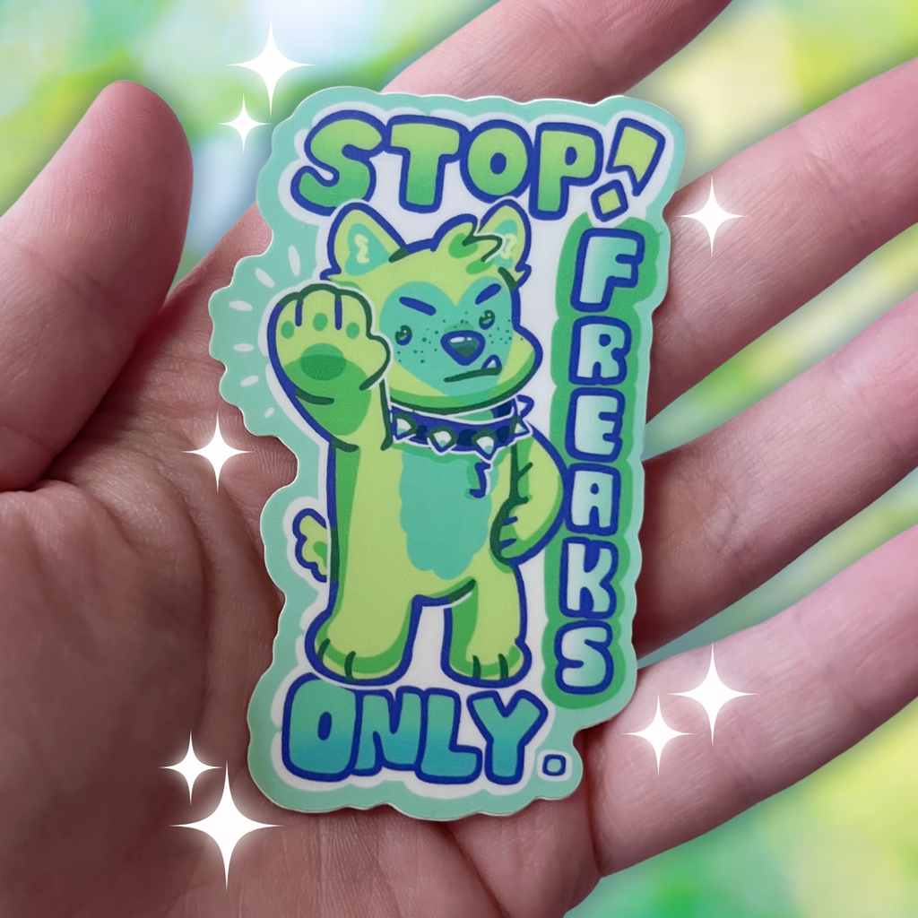 A sticker that has a green puppy holding their hand out with text that says "stop! freaks only."