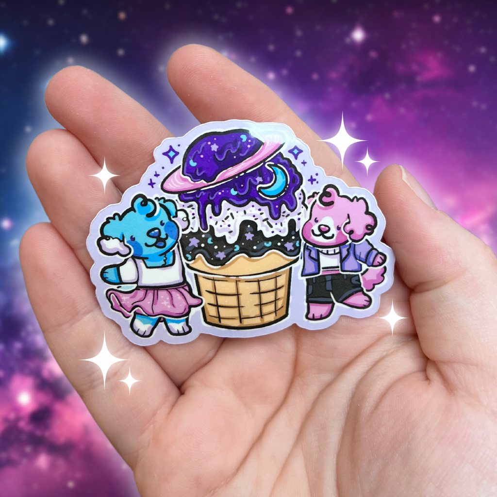 A sticker of Sky the blue puppy and Pearl the pink puppy next to a giant space themed ice cream cone