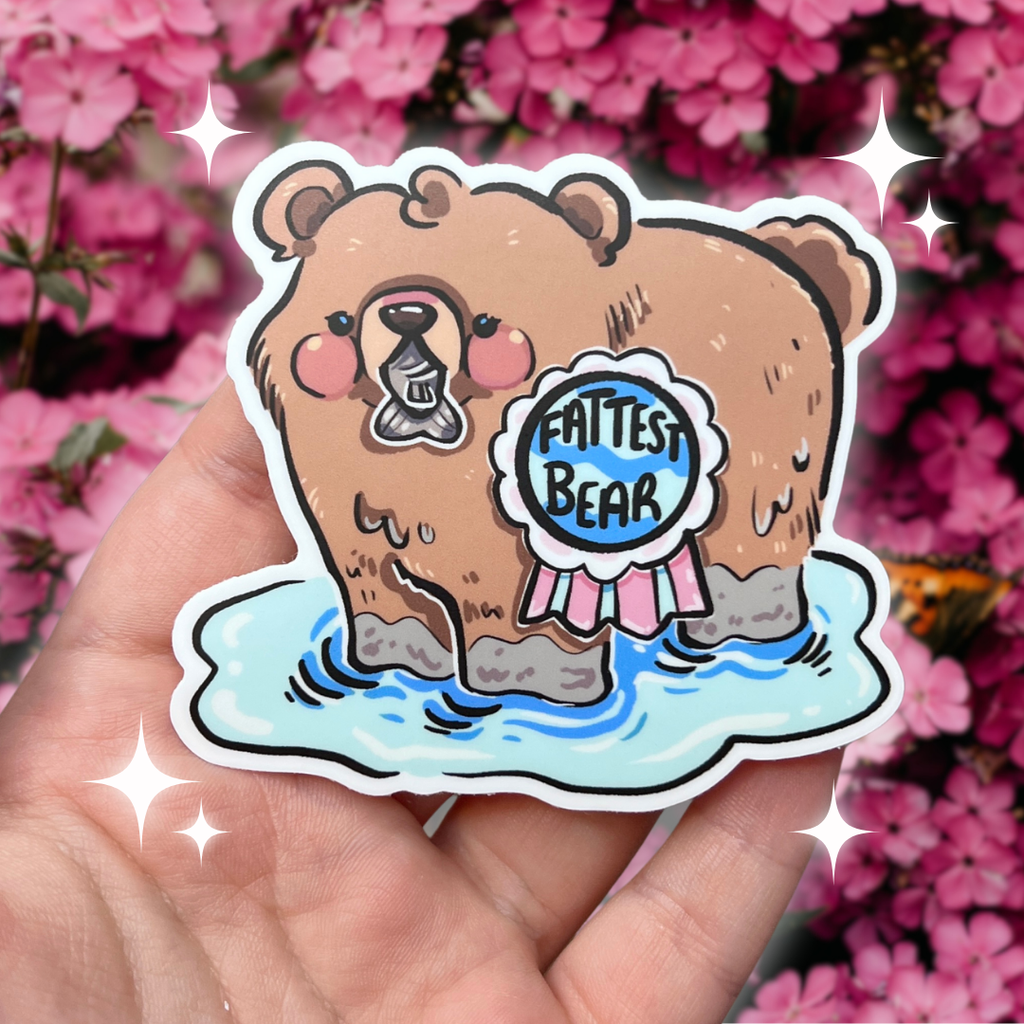 A sticker of a bear in water /w a fish in its mouth and a medallion that says "fattest bear"