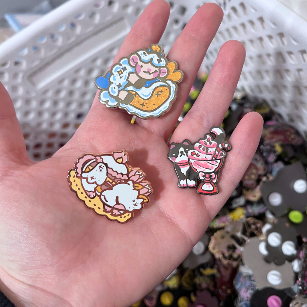 A hand holding some of the possible defect pins