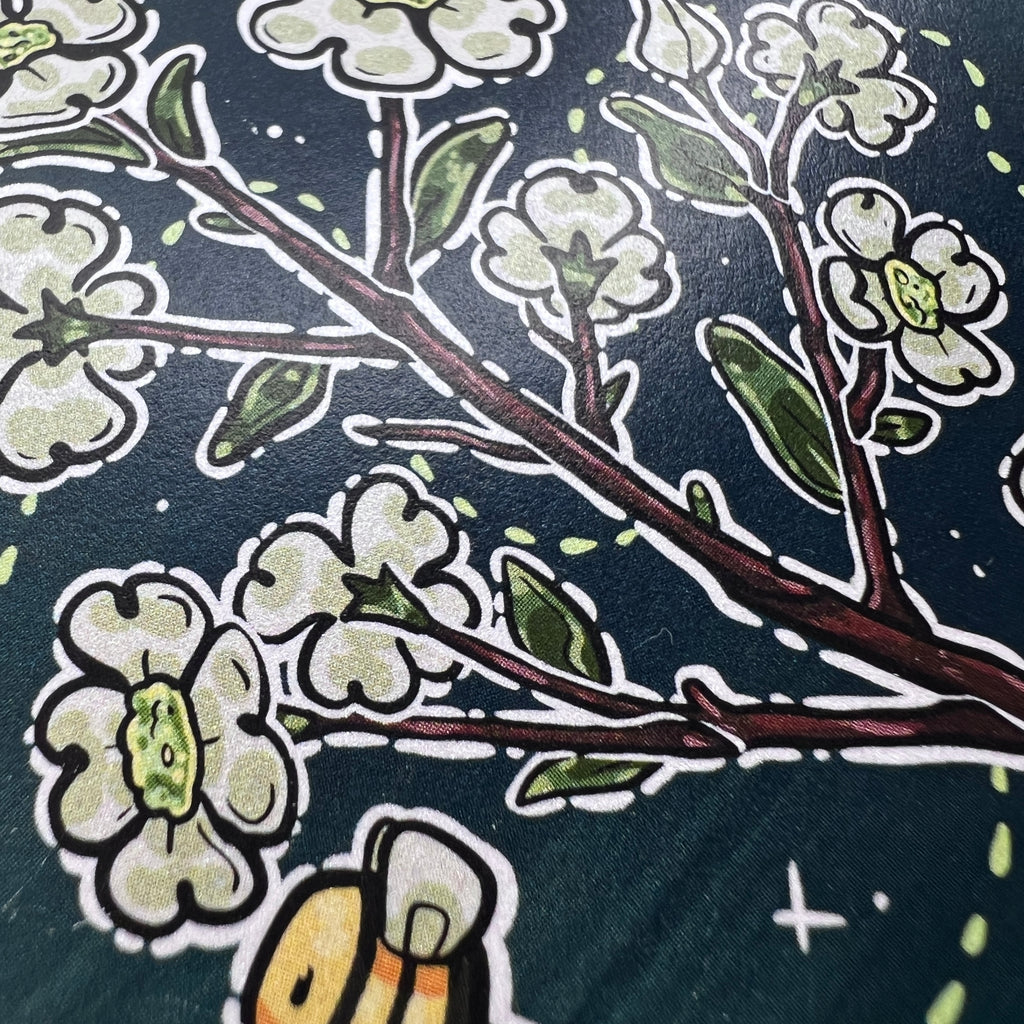 A print of a branch of dogwood flowers with 3 bees flying around