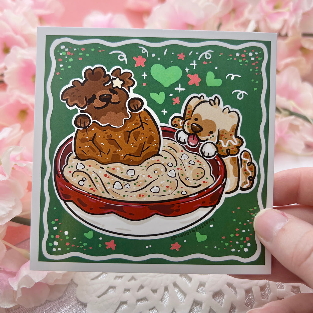 A print of Cinnamon the Gingersnap puppy and Caramel the Sugarcookie puppy digging into cheesecake dip with a gingersnap