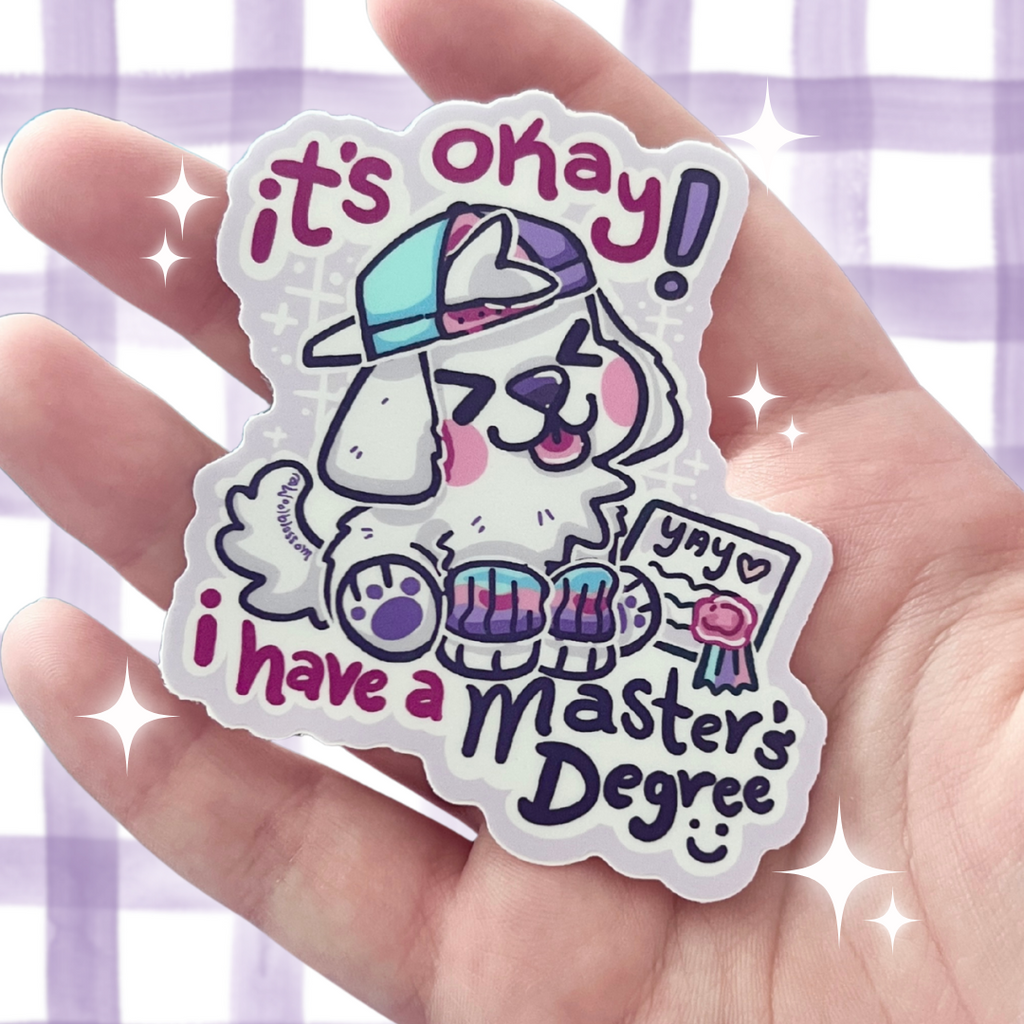 Sticker with a cartoon dog wearing a cap and glasses, text 'it's okay! yay i have a Master's Degree' held in a hand against a light purple checkered background.