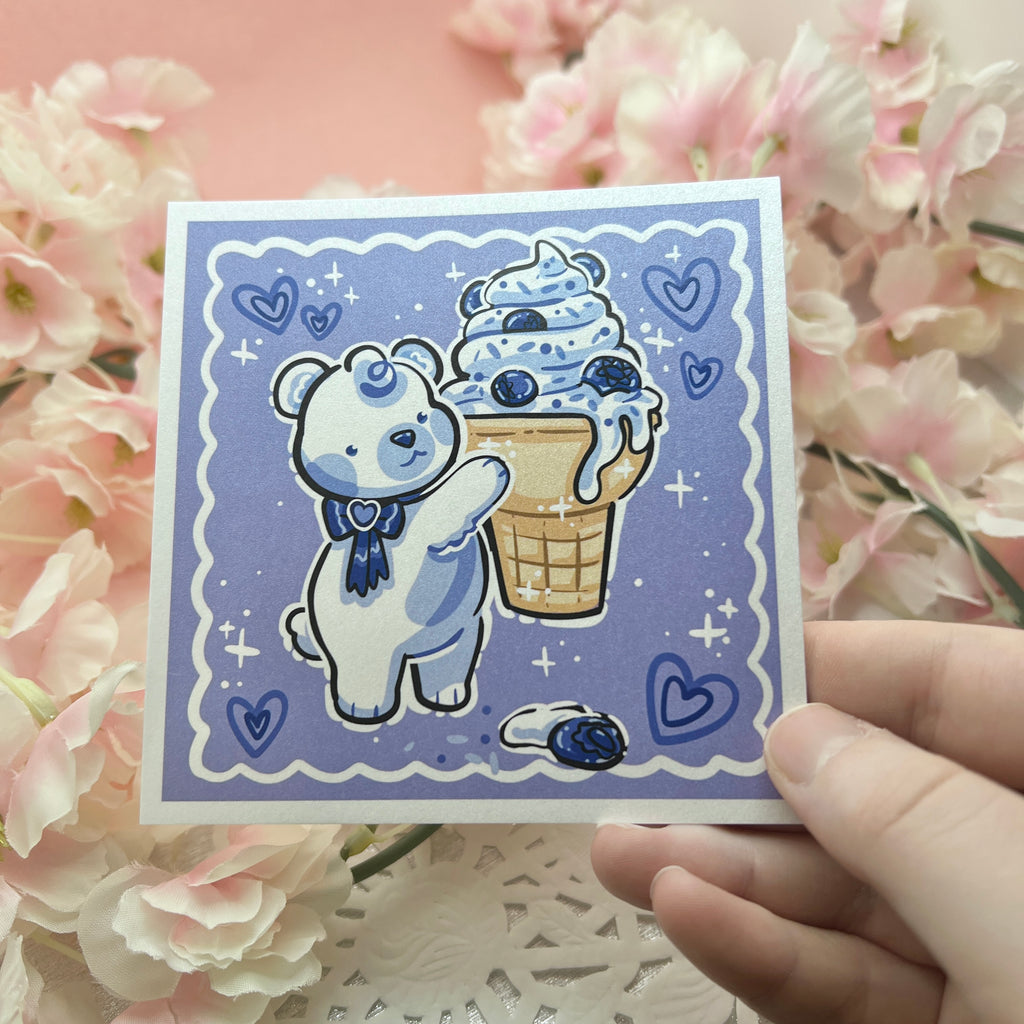 A print of a polar bear holding a blueberry ice cream