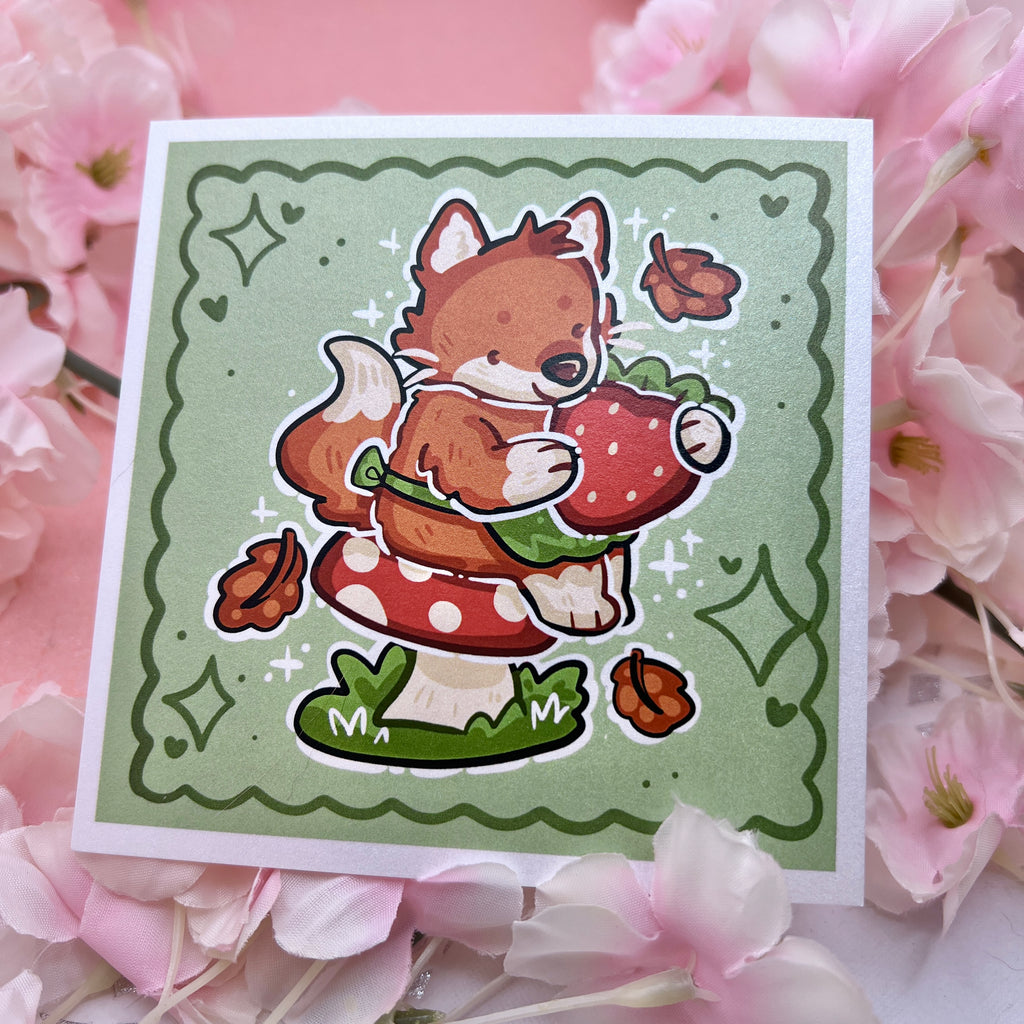 A print of a red fox with a little green apron sitting on a red mushroom, holding a strawberry with autumn leaves falling