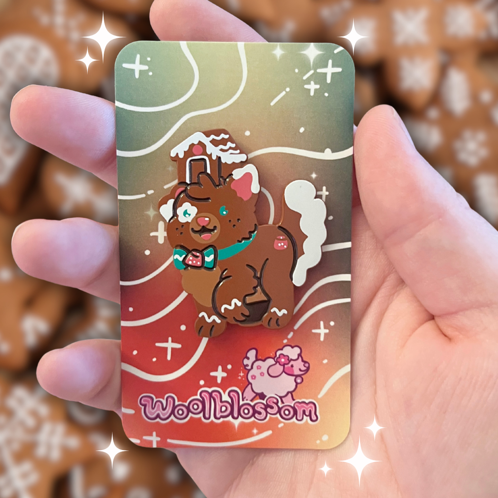 An enamel of a brown dog with a gingerbread house on her head