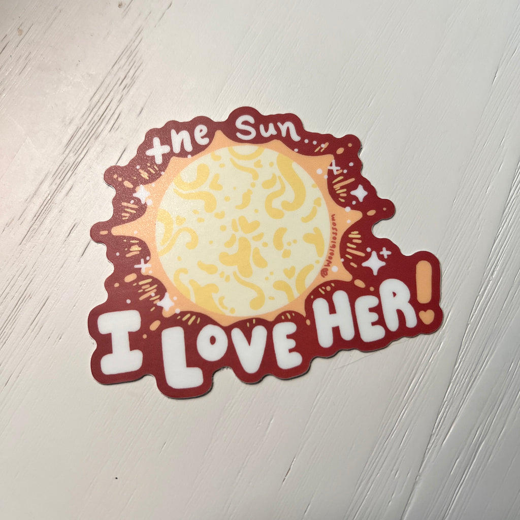 Sticker with sun design and text 'I Love Her' against a white background