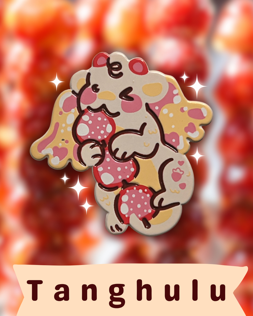 Tanghulu strawberry dragon enamel pin on a red fruit background with 'Tanghulu' branding.