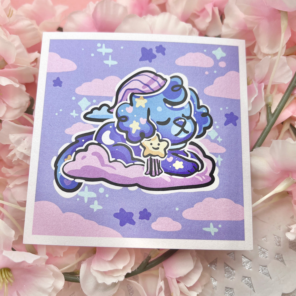 A print of a puppy with a bedtime cap, blue skin, and star bow on a pink cloud in a blue sky