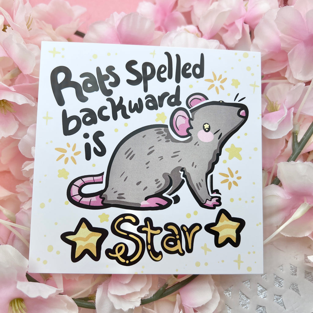 a print of a gray rat with the text "rats spelled backward is star" and gold star accents