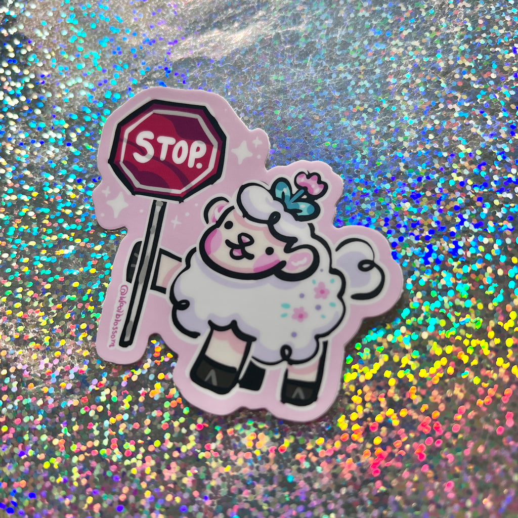  a sticker of a sheep holding a stop sign against a glittery background.