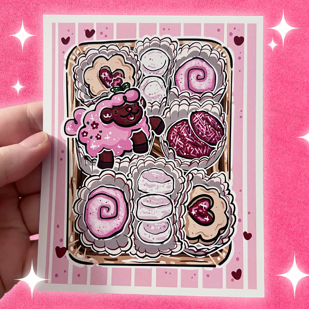 A print of tulip the sheep laying in a box of cookies, with a pink valentines theme