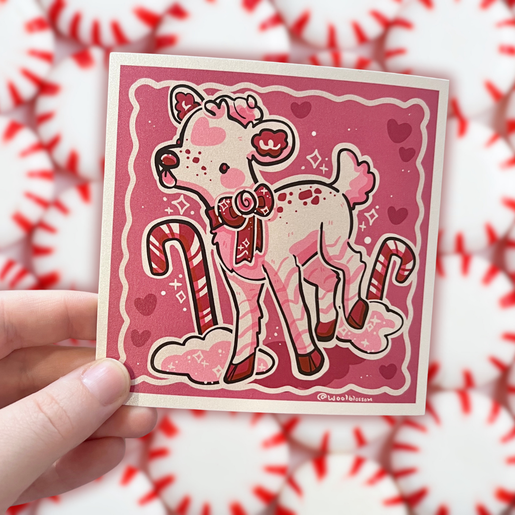 A print of a white deer that has pink and red accents and is peppermint themed