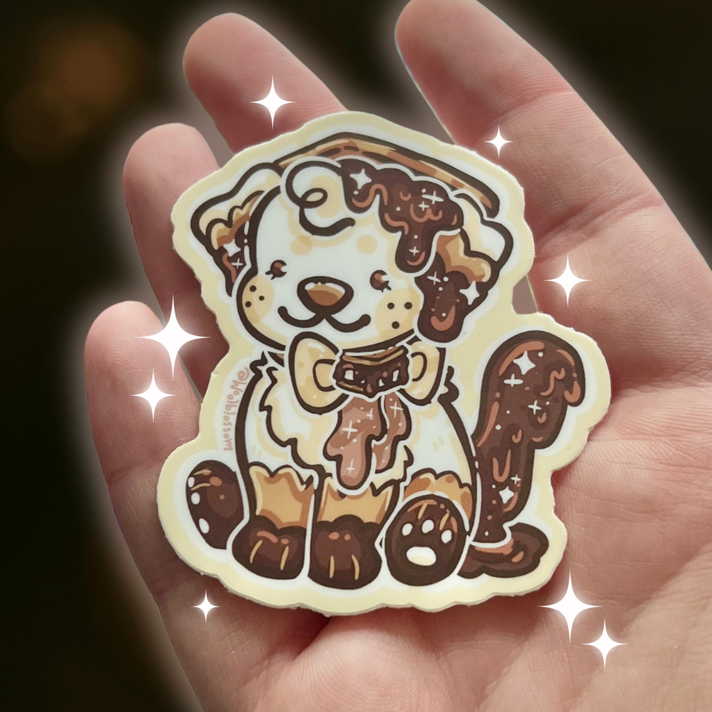 Sticker of a cartoon dog held in a hand with a dark background