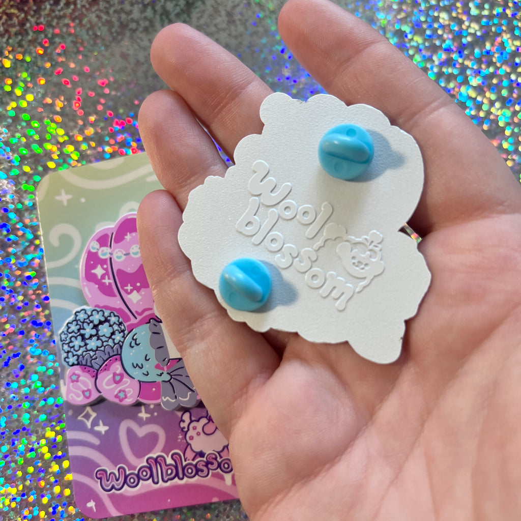 Showing the back stamp of the pin