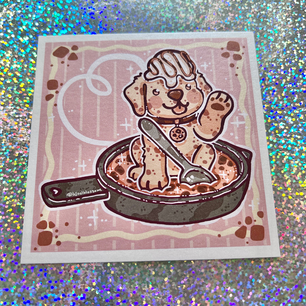 print of a puppy in a cookie skillet on a glittery background