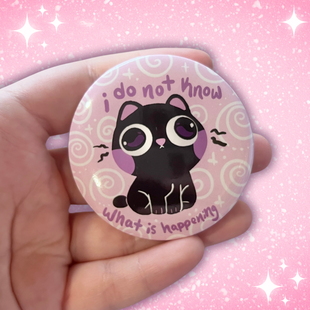 A button of a black cat looking blankly confused against a pale pink/purple background that has white swirls. Text around them says "i do not know what is happening"