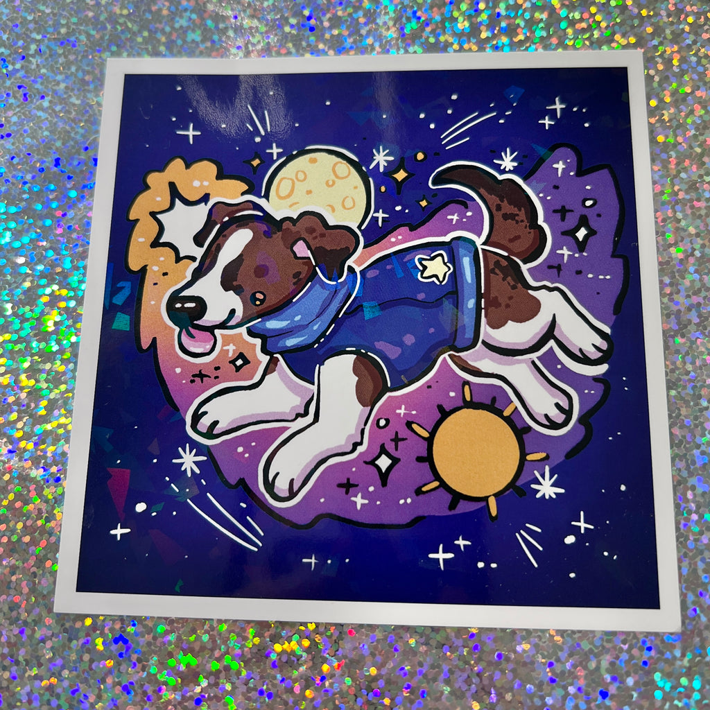 Print of a dog in a space-themed outfit on a glittery background
