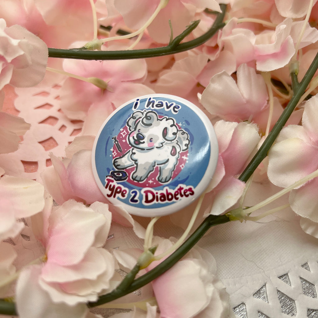 a button that says "I have type two diabetes" as well as a puppy. It also features a needle and blood reader.