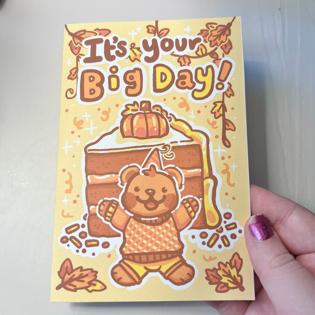 Card with a bear illustration and 'It's your Big Day!' text, held by a hand.