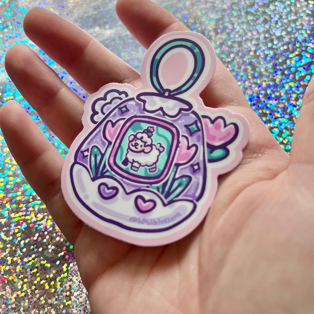 Hand holding a colorful sticker of sprout the sheep in a digital toy against a glittery background