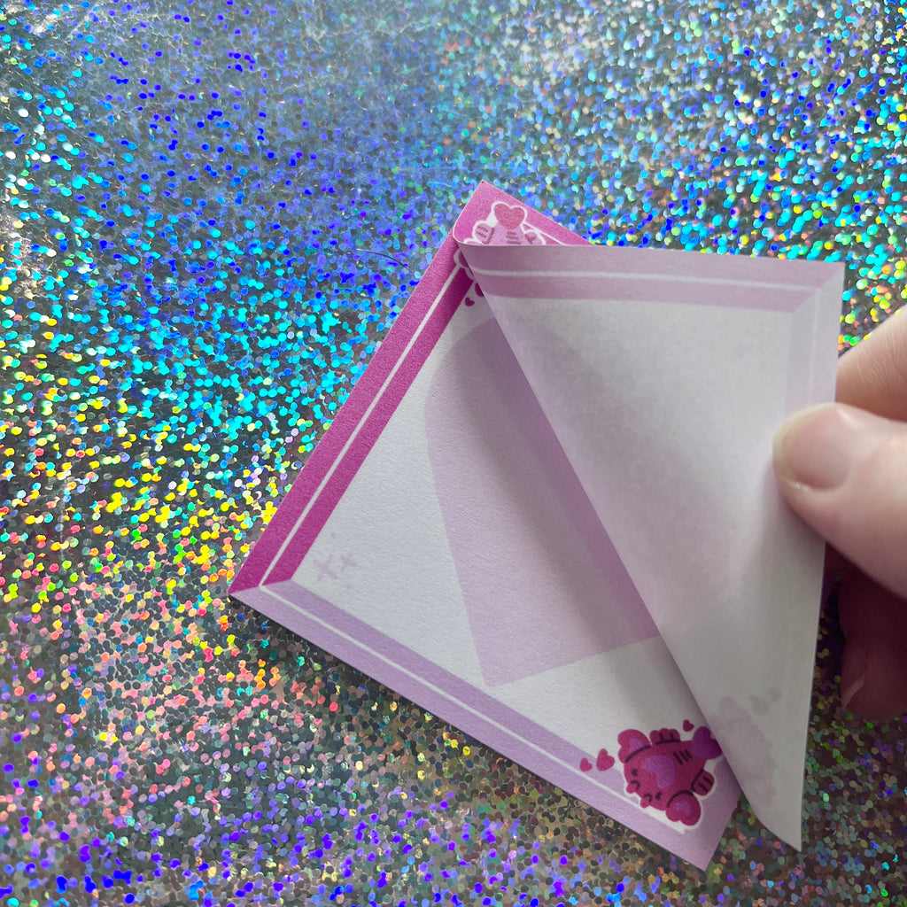 pink sticky notes that have love lobsters in the corners with corner up